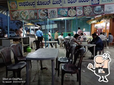 Take a seat at one of the tables at Raghavendra Hotel
