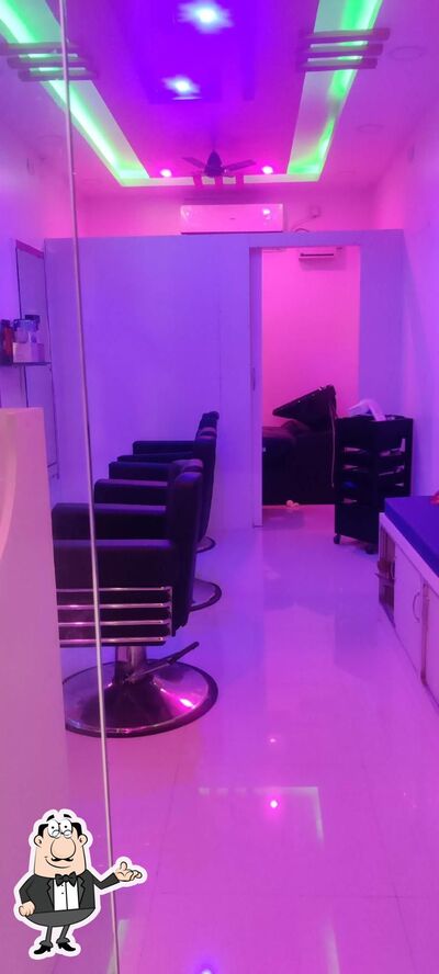 Take a seat at one of the tables at AL- Madina Biryani Center