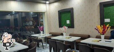 Take a seat at one of the tables at Green Haveli