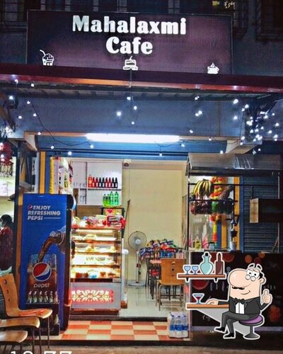 Take a seat at one of the tables at Mahalaxim cafe