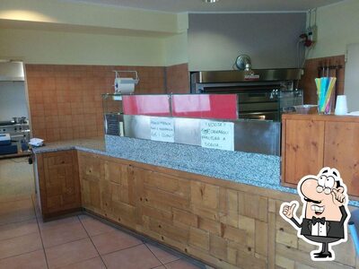 Siediti a un tavolo di Gran Pizza