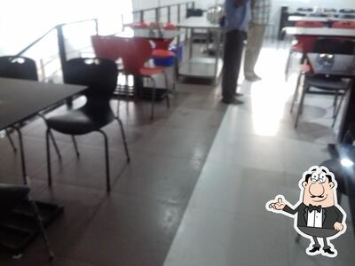 Take a seat at one of the tables at സ്നേഹജാലകം ജനകീയ ഭക്ഷണശാല