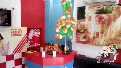 Take a seat at one of the tables at PIZZA HUB SUDDHOWALA