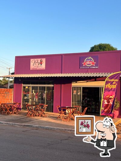 Sente em uma das mesas no CANTINHO DO AÇAI, AÇAITERIA E DISTRIBUIDORA DE BEBIDAS