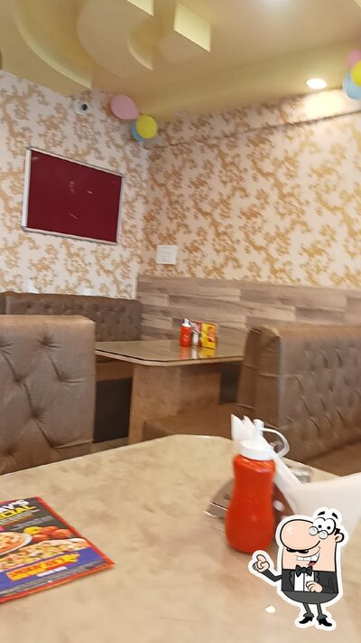 Take a seat at one of the tables at Smokin' Joe's Srinagar