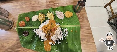 Take a seat at one of the tables at Rakesh Sweets