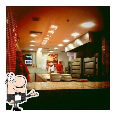 O interior do Pizza & Cia