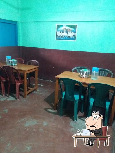 Take a seat at one of the tables at ladakh restaurant
