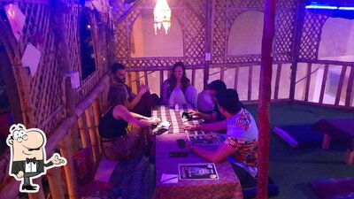 Take a seat at one of the tables at Tapasya Cafe