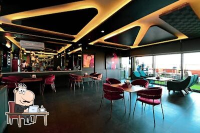 Take a seat at one of the tables at Samaa Rooftop