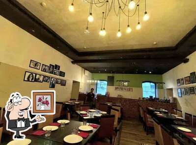 Take a seat at one of the tables at Gabbar's Bar & Kitchen