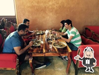Take a seat at one of the tables at Khana