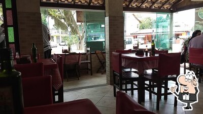 Sente em uma das mesas no Restaurante do Beto