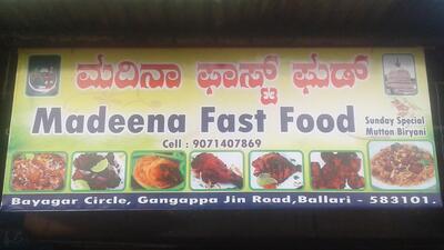 The advertisement shows information about Madeena Fast Food
