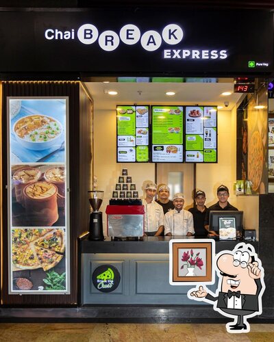 Take a seat at one of the tables at Chai Break - Rangoli Mall