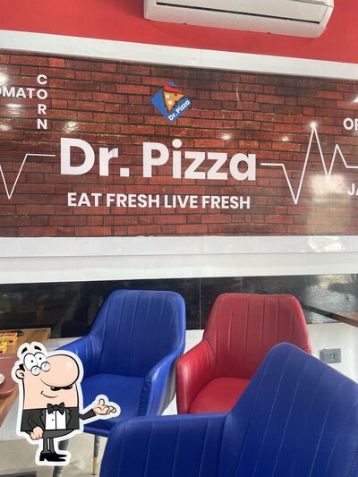 Take a seat at one of the tables at Dr.Pizza