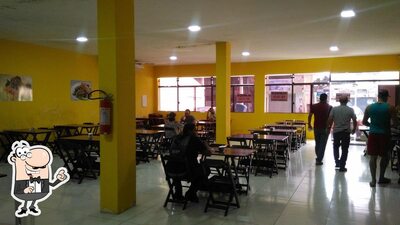 Sente em uma das mesas no Dona Nete Restaurante