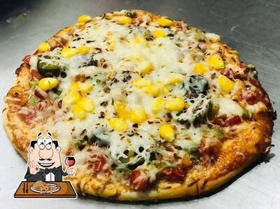 At Mansi Fast Food & Ice Cream, you can taste pizza