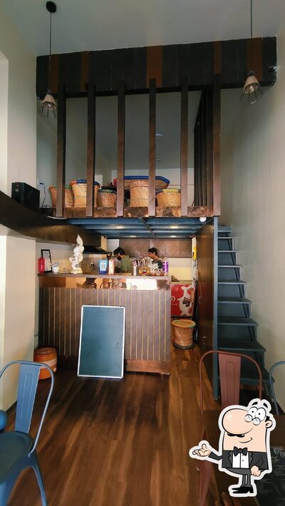 Take a seat at one of the tables at Singing Beans Cafe