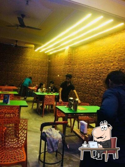 Take a seat at one of the tables at Lajawab Restaurant