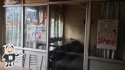 Take a seat at one of the tables at Ramakrishna Restaurant, Ruthiyai