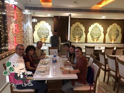 Take a seat at one of the tables at Manika Restaurants
