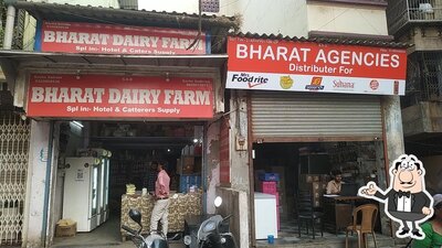 Take a seat at one of the tables at Bharat Agencies
