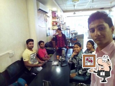 Take a seat at one of the tables at Fire & Ice Family Restaurant Restaurant in Ujjain