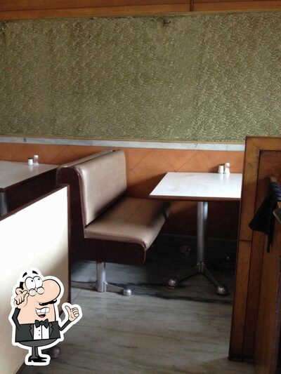Take a seat at one of the tables at Mid Town