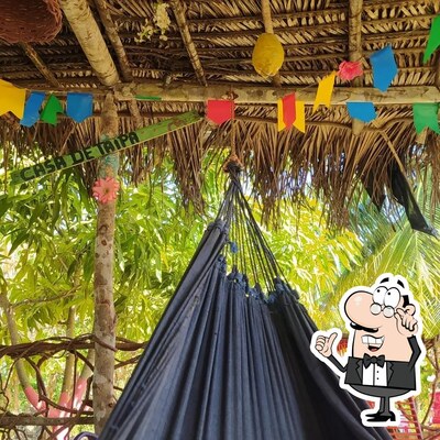Sente em uma das mesas no Restaurante Rural casa de Taipa Tambaba