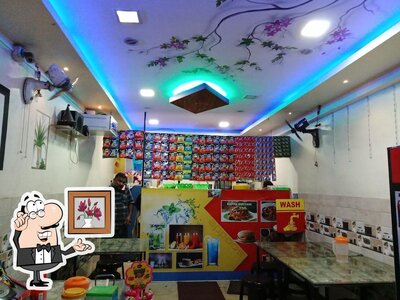Take a seat at one of the tables at Basila Cool Bar & Tea Stall