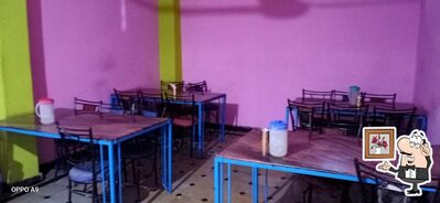 Take a seat at one of the tables at Nisarga Family Restaurant