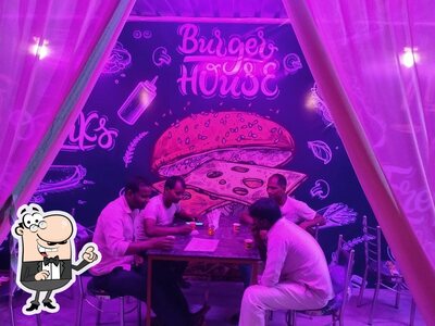 Take a seat at one of the tables at Dadda chai cafe & restaurant