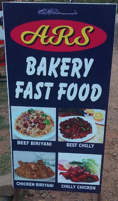 The advertisement displays information about ARS BAKERY& FAST FOOD