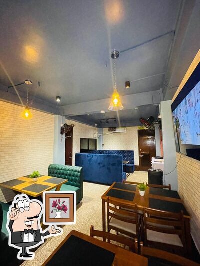 Take a seat at one of the tables at PRADHAN'S RESTAURANT