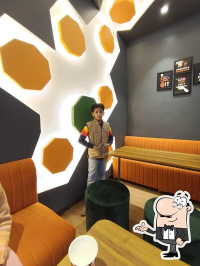 Take a seat at one of the tables at Cafe on Demand