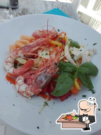 Assaggia i sapori della cucina di mare al ristorante Encanto White Beach Restaurant