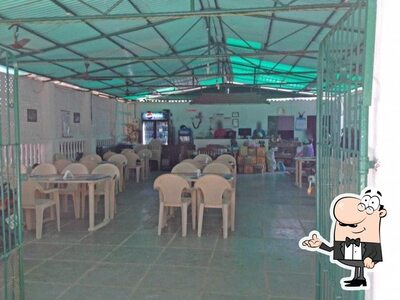 Take a seat at one of the tables at Caji Square