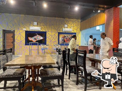 Take a seat at one of the tables at Fish Andhra - Lounge