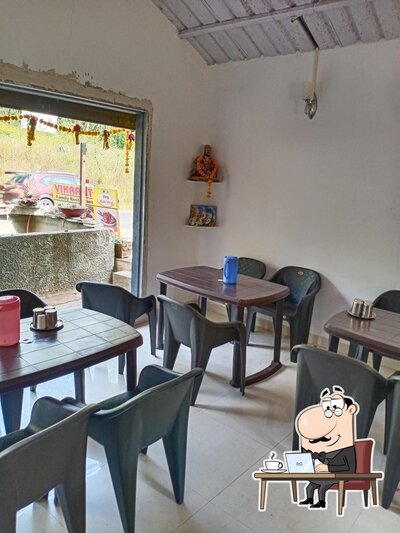 Take a seat at one of the tables at Vikrant family restaurant veg and non veg
