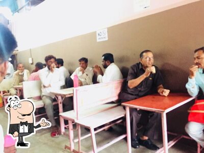 Take a seat at one of the tables at मेघराज टी हाउस